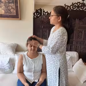 Students of Reiki 2 workshop on 26 Jul 2025 practicing reiki with Reiki 2 symbols on each other